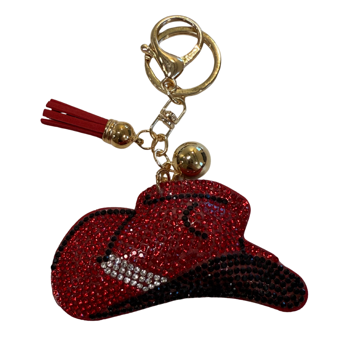 Keychain with red and black cowgirl hat  and tassel on a white background